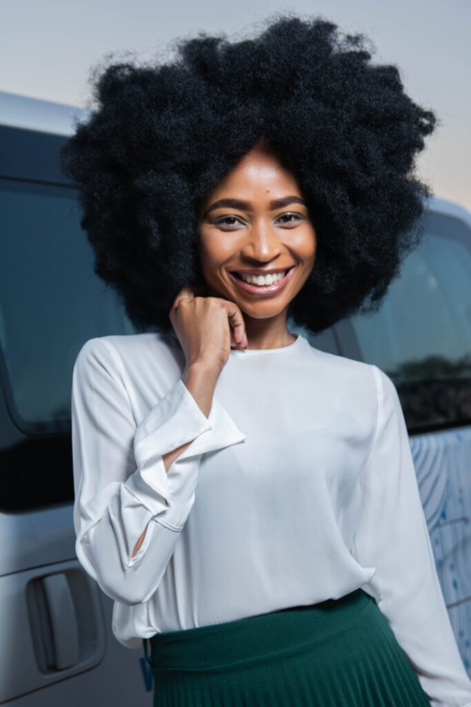 Woman confidently embracing her natural 4C hair