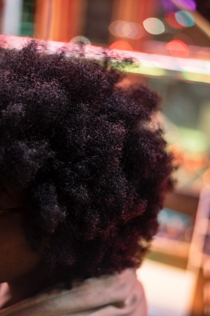 Close-up view of healthy and defined 4C hair coils