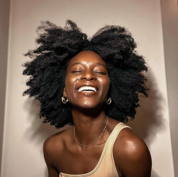 happy woman with healthy natural hair