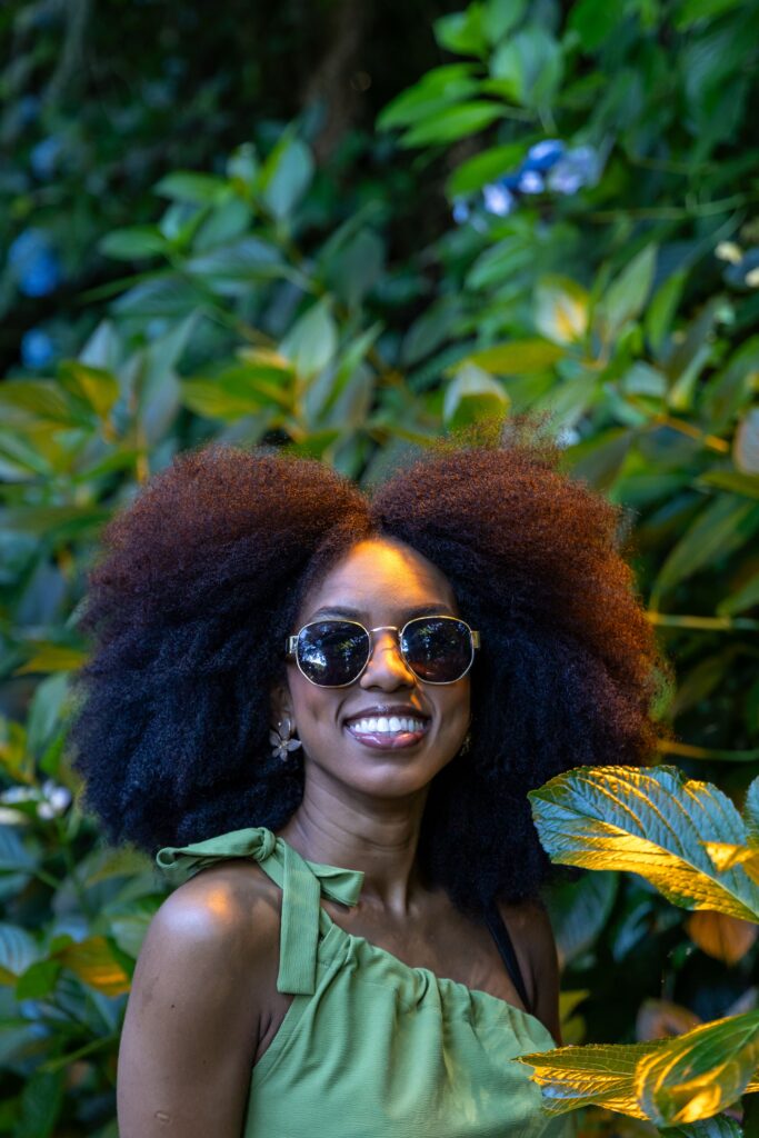 Woman wearing long healthy 4C hair