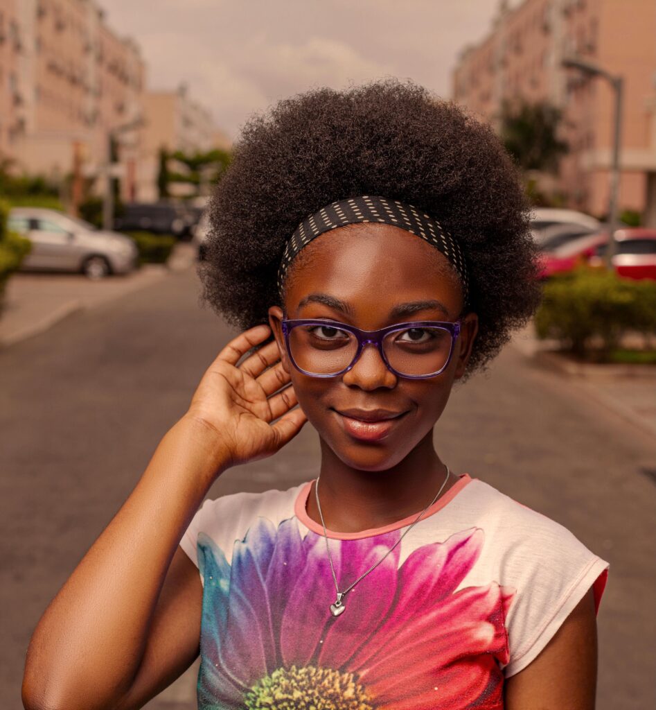 Woman confidently wearing her natural hair outdoors