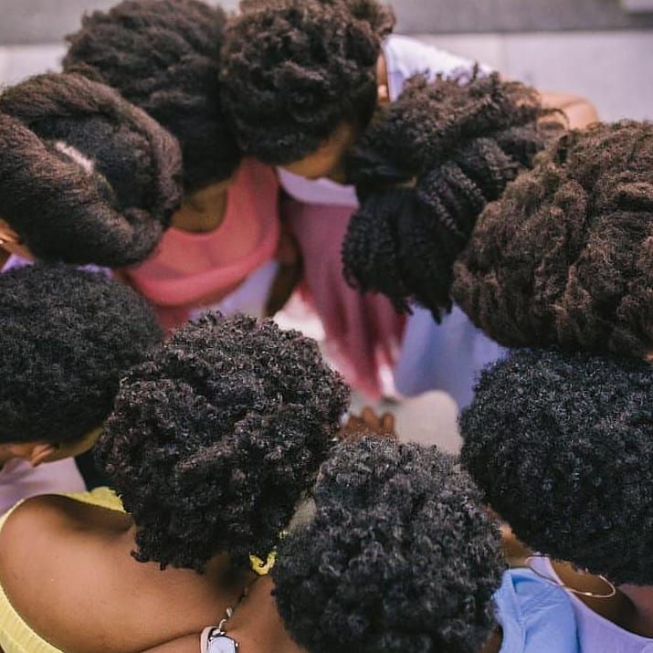 Different women with healthy 4C hair textures