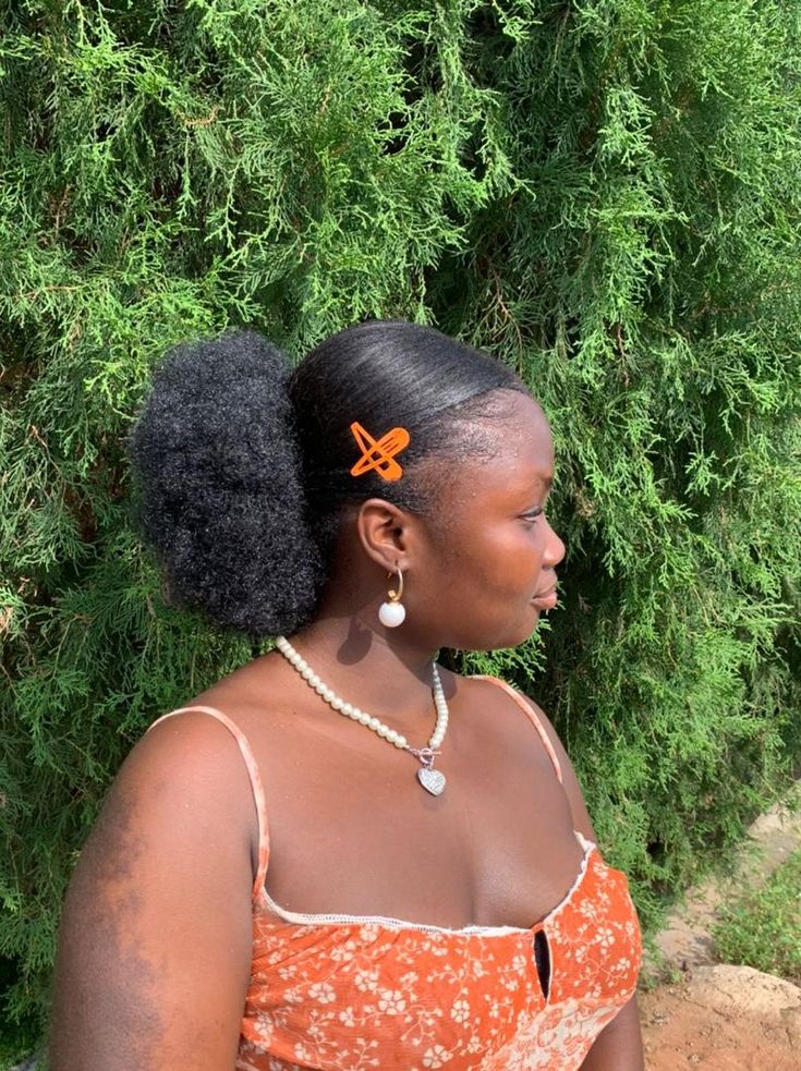 Afro ponytail hairstyle on natural hair.