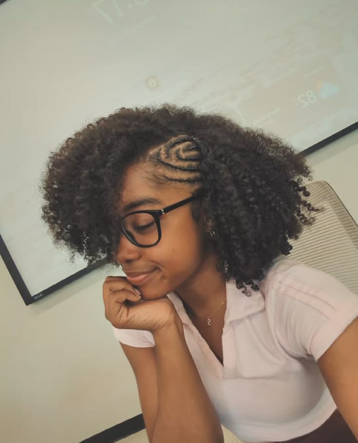 Natural 4C braid-out with neat side cornrows.