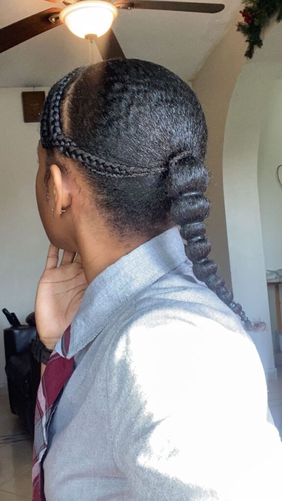 Bubble ponytail hairstyle on natural 4C hair.