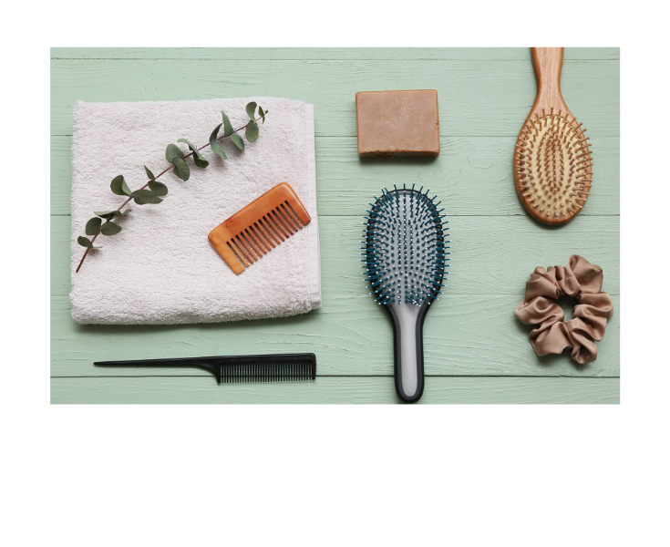 Clean natural hair tools neatly arranged on a towel after washing