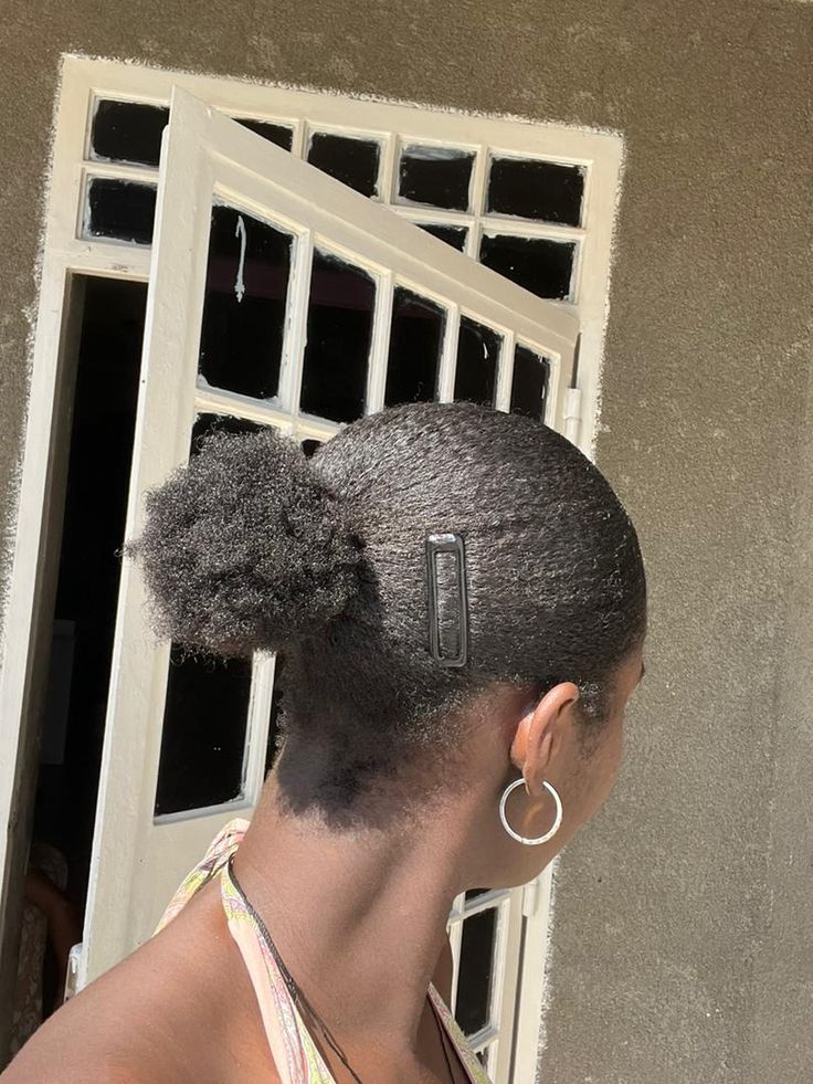 Clipped-back afro hairstyle for beginners with natural 4C hair.