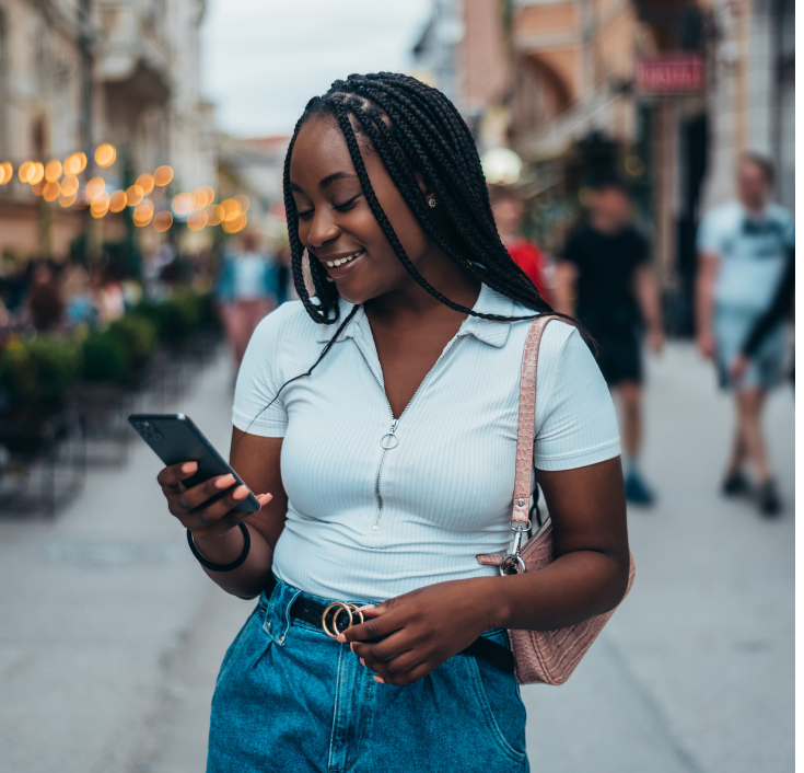 Black woman commuting with her 4C hair in a neat protective hairstyle