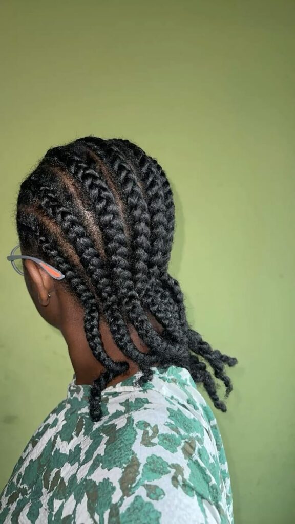 Straight-back cornrows on natural 4C hair.