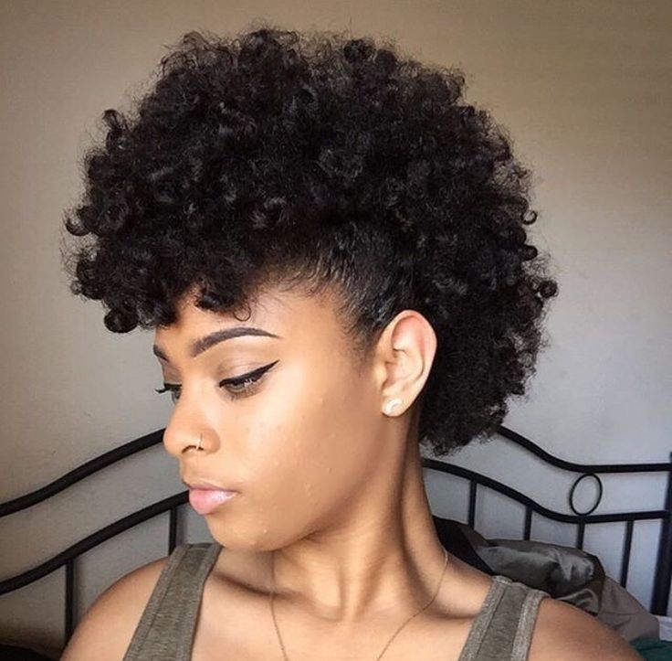 Curly faux hawk hairstyle on natural 4C hair.