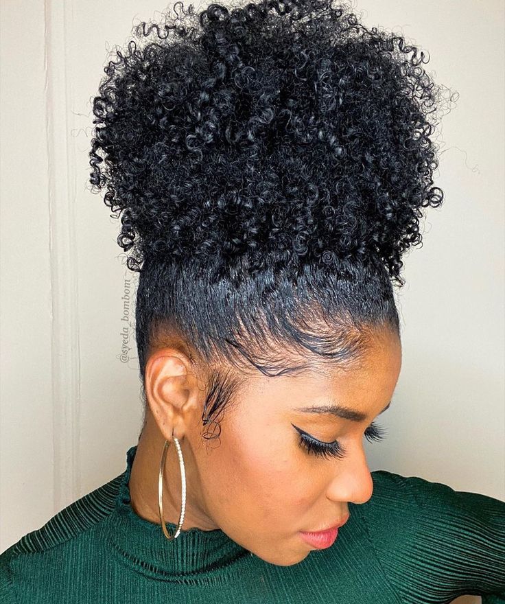 Curly high bun on natural 4C hair.