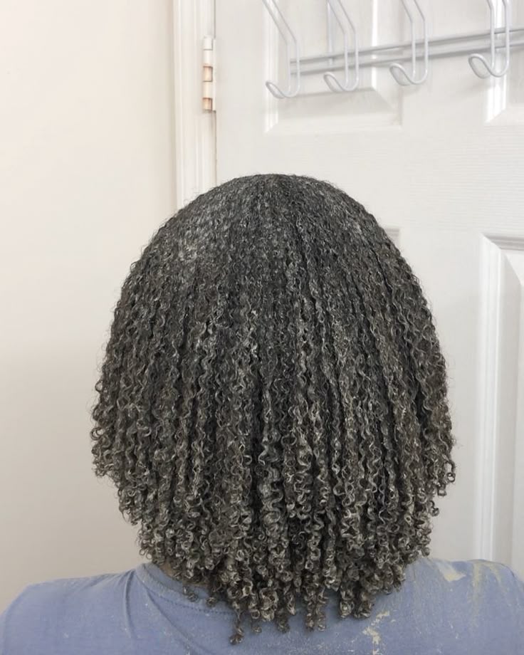 woman deep conditioning hair after taking down protective hairstyle