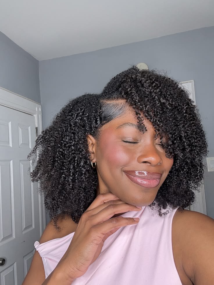 Deep side part wash-and-go on natural 4C hair.