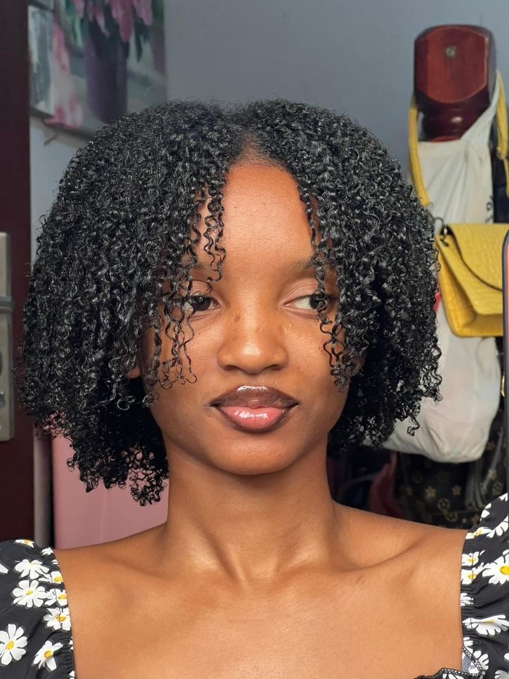 Defined coily wash-and-go style on natural 4C hair.
