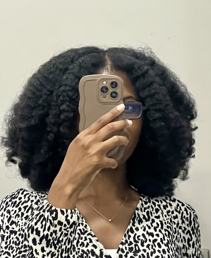 Easy twist-out hairstyle for beginners with 4C hair.