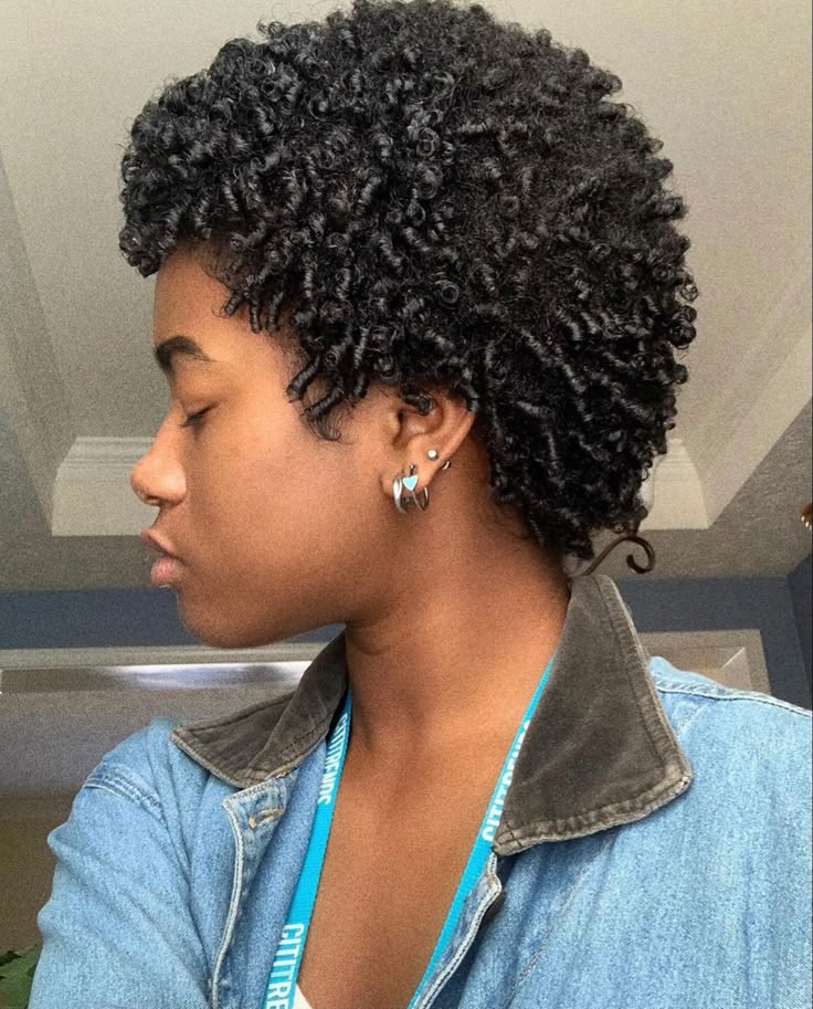 Finger coil hairstyle on natural 4C hair.