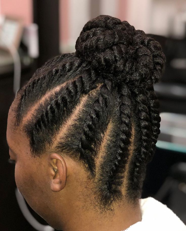 Elegant flat twist updo on natural 4C hair.