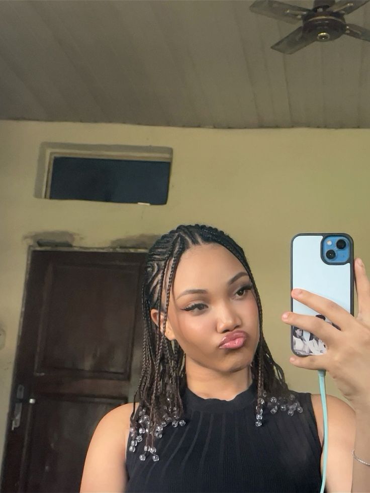 Fulani braids on healthy natural 4C hair.