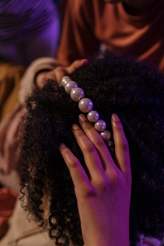 woman gently massaging her scalp with her fingertips
