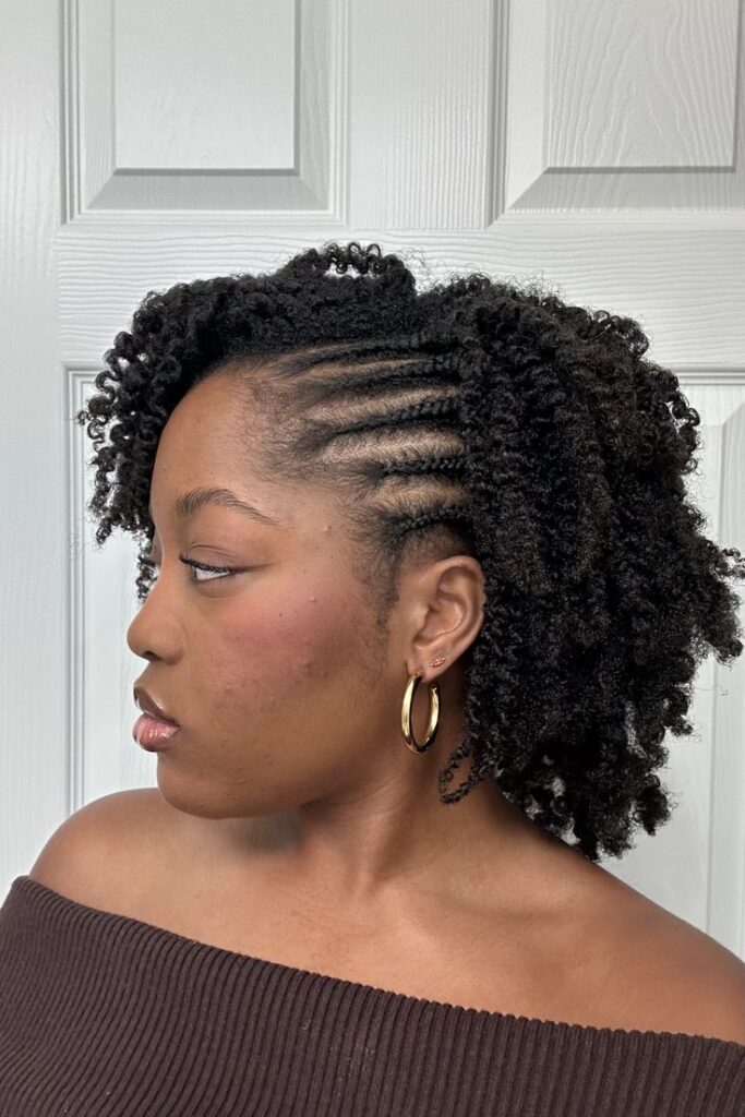 Half-braided twist-out hairstyle on natural 4C hair.