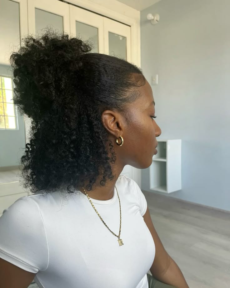 Half-up half-down braid-out on natural hair.