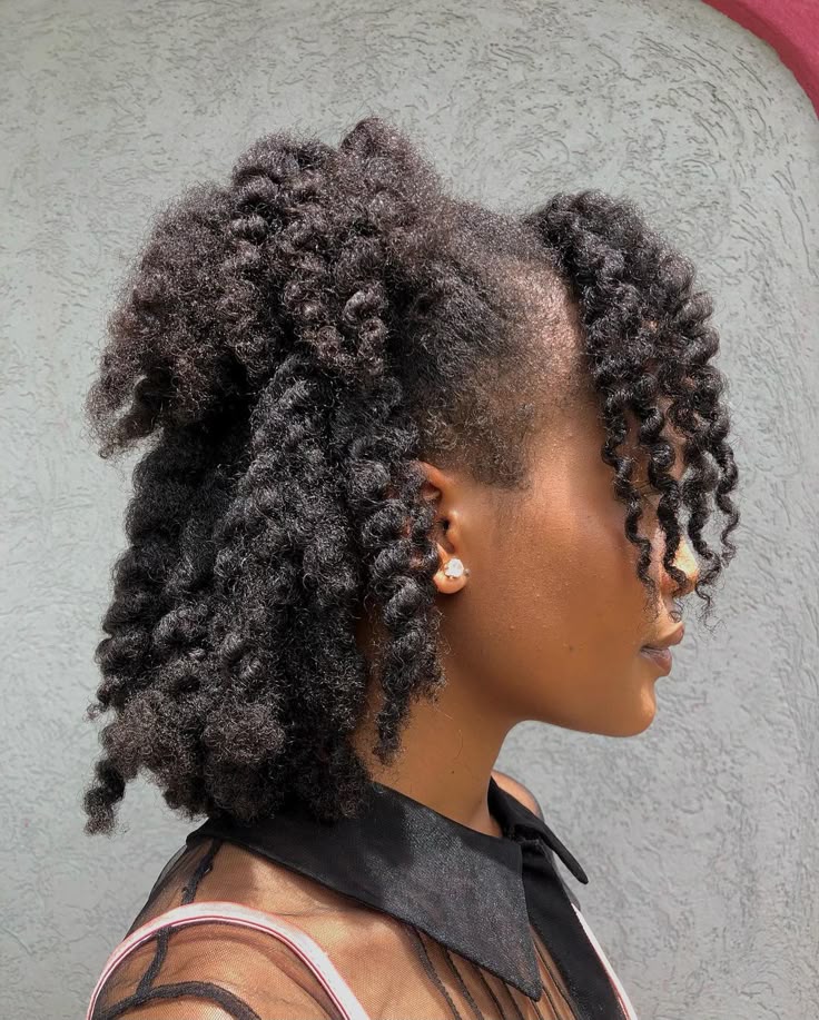 Half-up half-down  hairstyle on natural 4C hair.