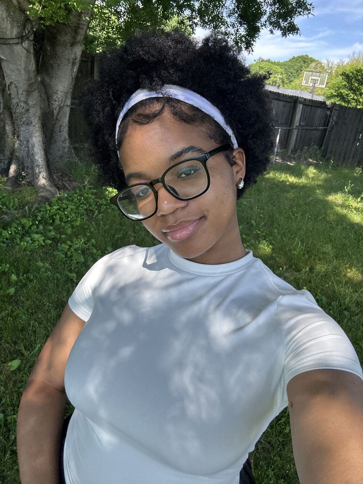 Natural 4C hairstyle styled with a fabric headband.