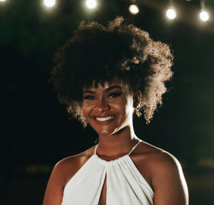 woman with healthy hair at night after daily hair care routine