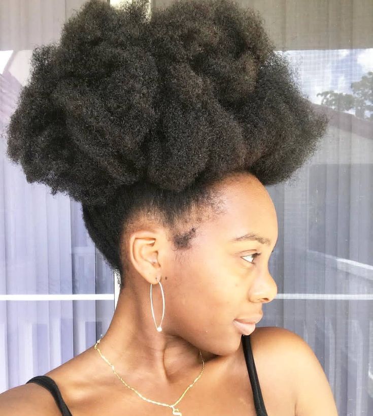 High puff hairstyle on natural 4C hair.