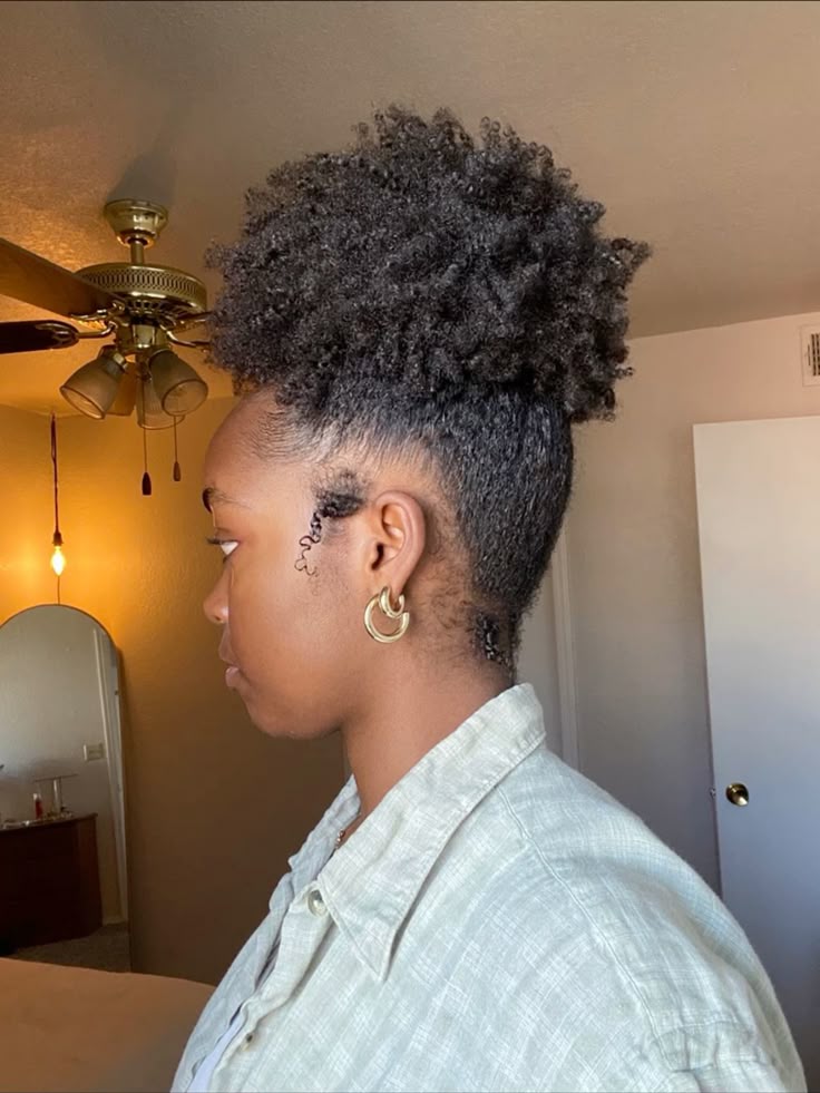 High puff style on natural hair.