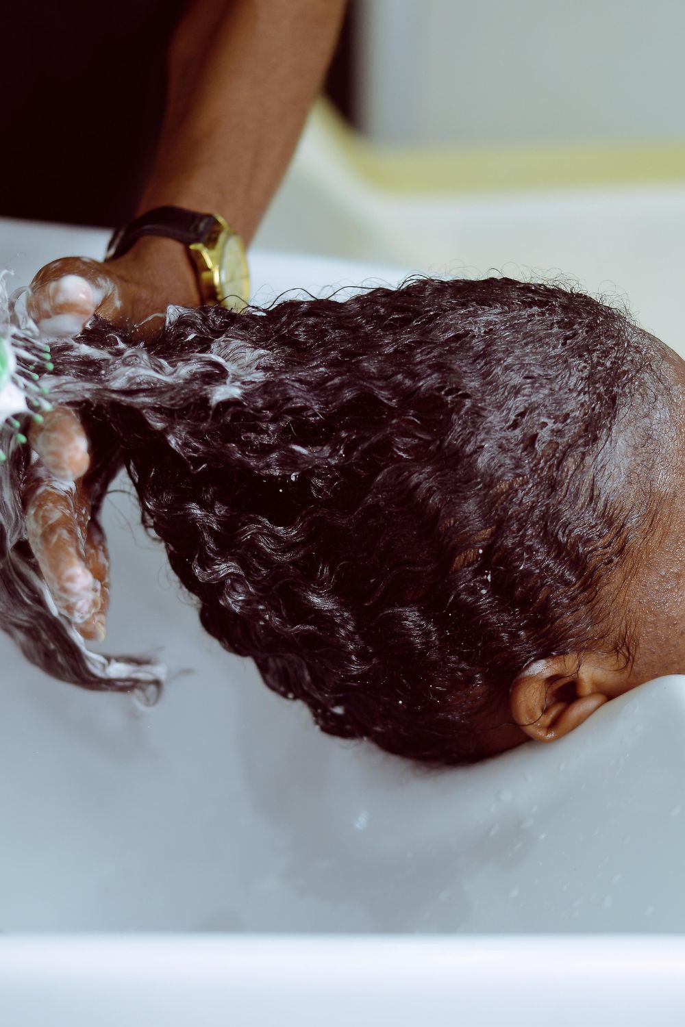 woman getting her hair washed