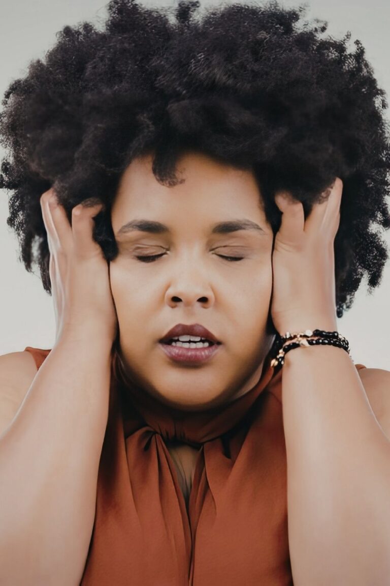 woman visibly frustrated at her hair breakage