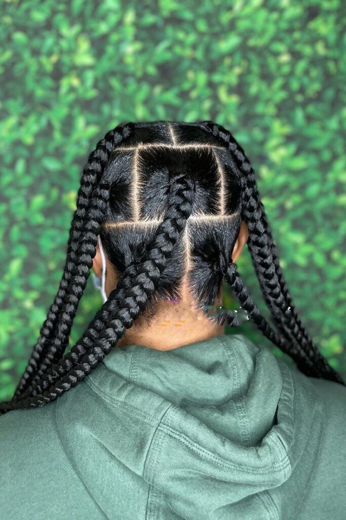 Jumbo braids on healthy natural 4C hair.