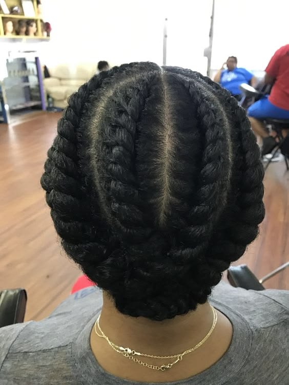 Jumbo flat twists on natural 4C hair.