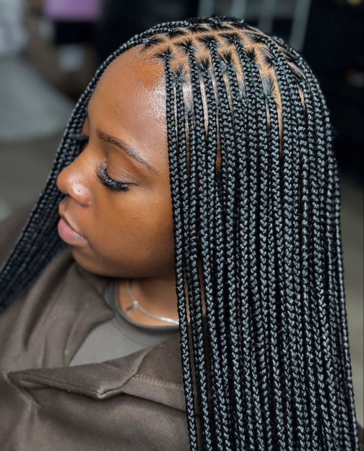 Knotless braids on natural 4C hair.