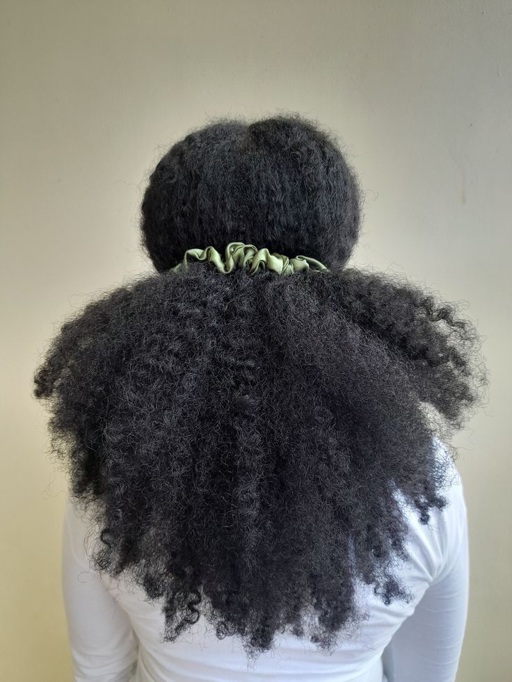 Loose low puff hairstyle for beginners with natural 4C hair.