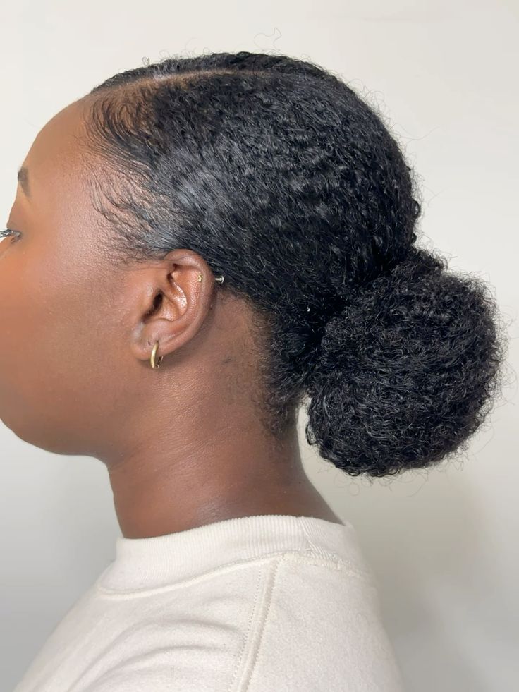 Low bun on natural afro hair.