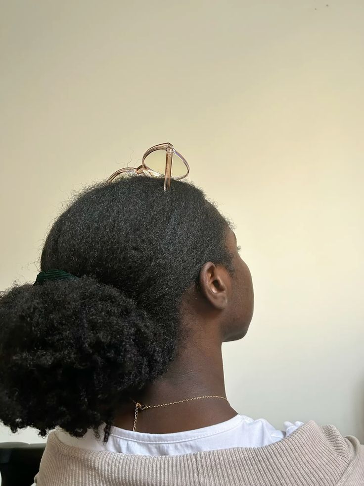 Low puff created from a braid-out on natural hair.