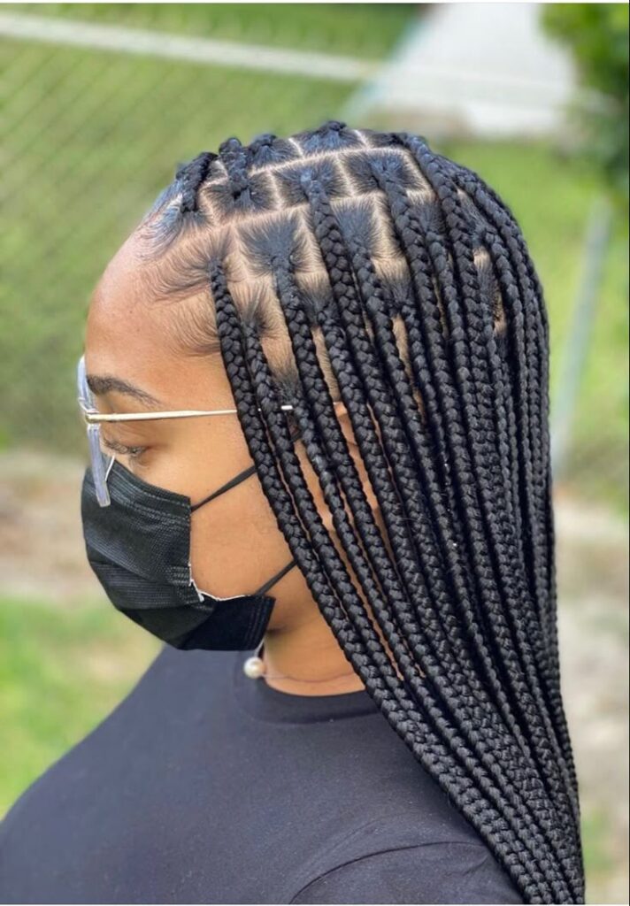 Medium knotless braids on natural hair.