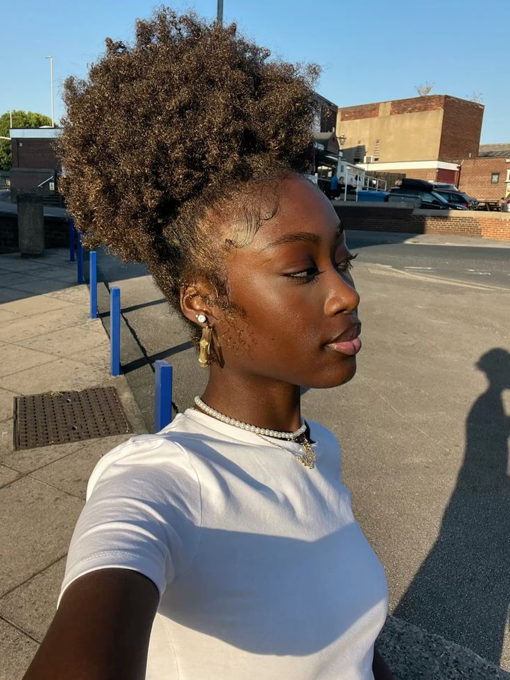 Messy puff hairstyle for beginners with natural 4C hair.