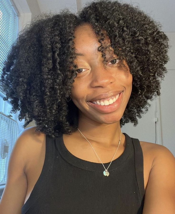 Middle-part braid-out on natural hair.