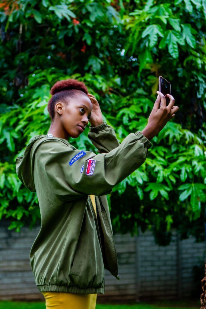 Girl taking selfie to document hair growth progress