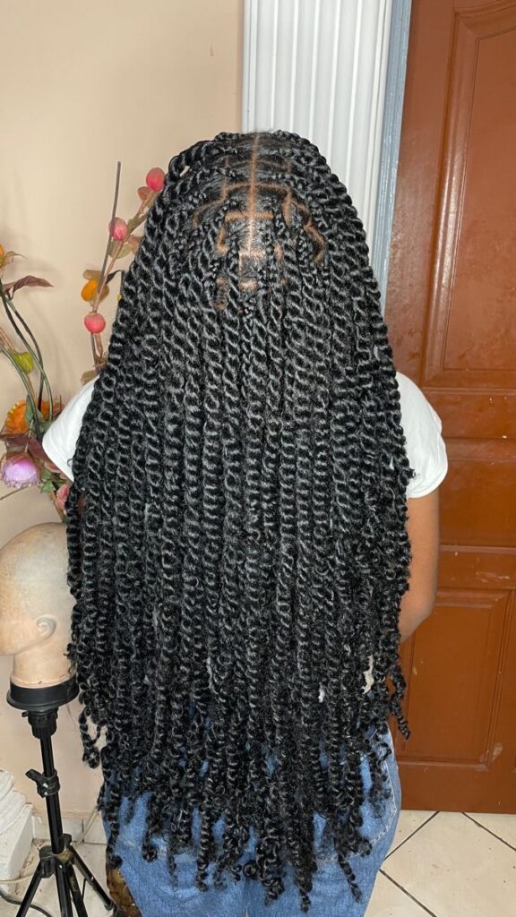 Long passion twists on healthy natural 4C hair.
