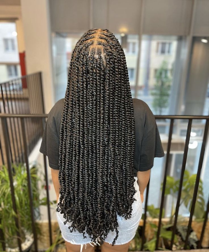Passion twists protective hairstyle on natural hair.