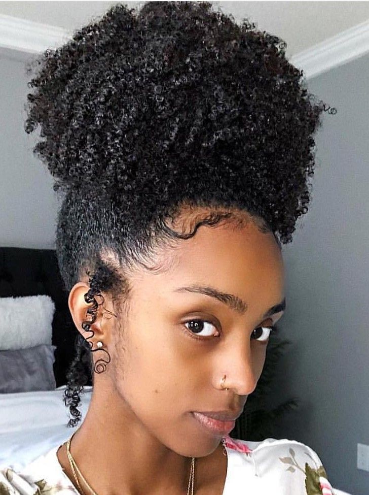 Pineapple hairstyle on natural hair.