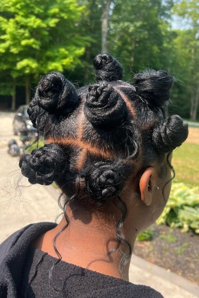 woman wearing a protective hairstyle to prevent 4c hair breakage