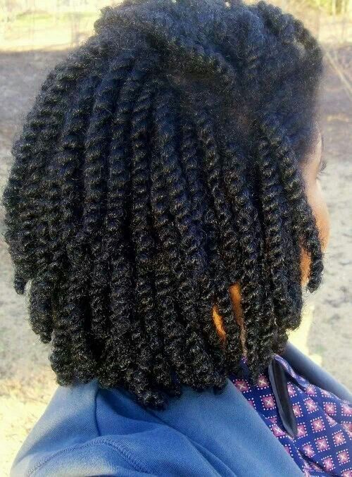 Close-up of new growth in a protective hairstyle.