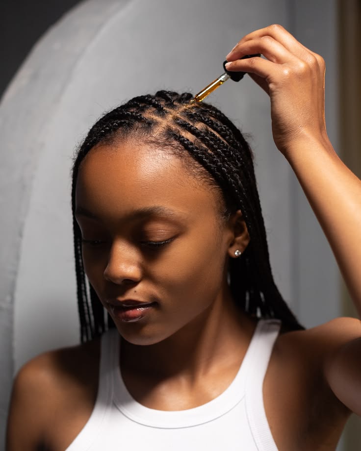 Woman caring for protective braids