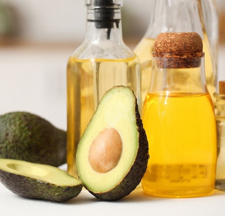Pure avocado oil in a glass bottle for natural 4C hair.
