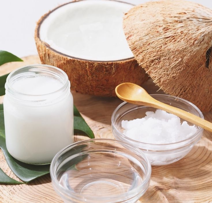 Pure coconut oil in a glass jar for natural 4C hair care.